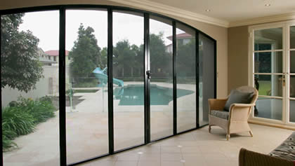 Security doors screen for house, in the room we can see a swimming pool in the yard.